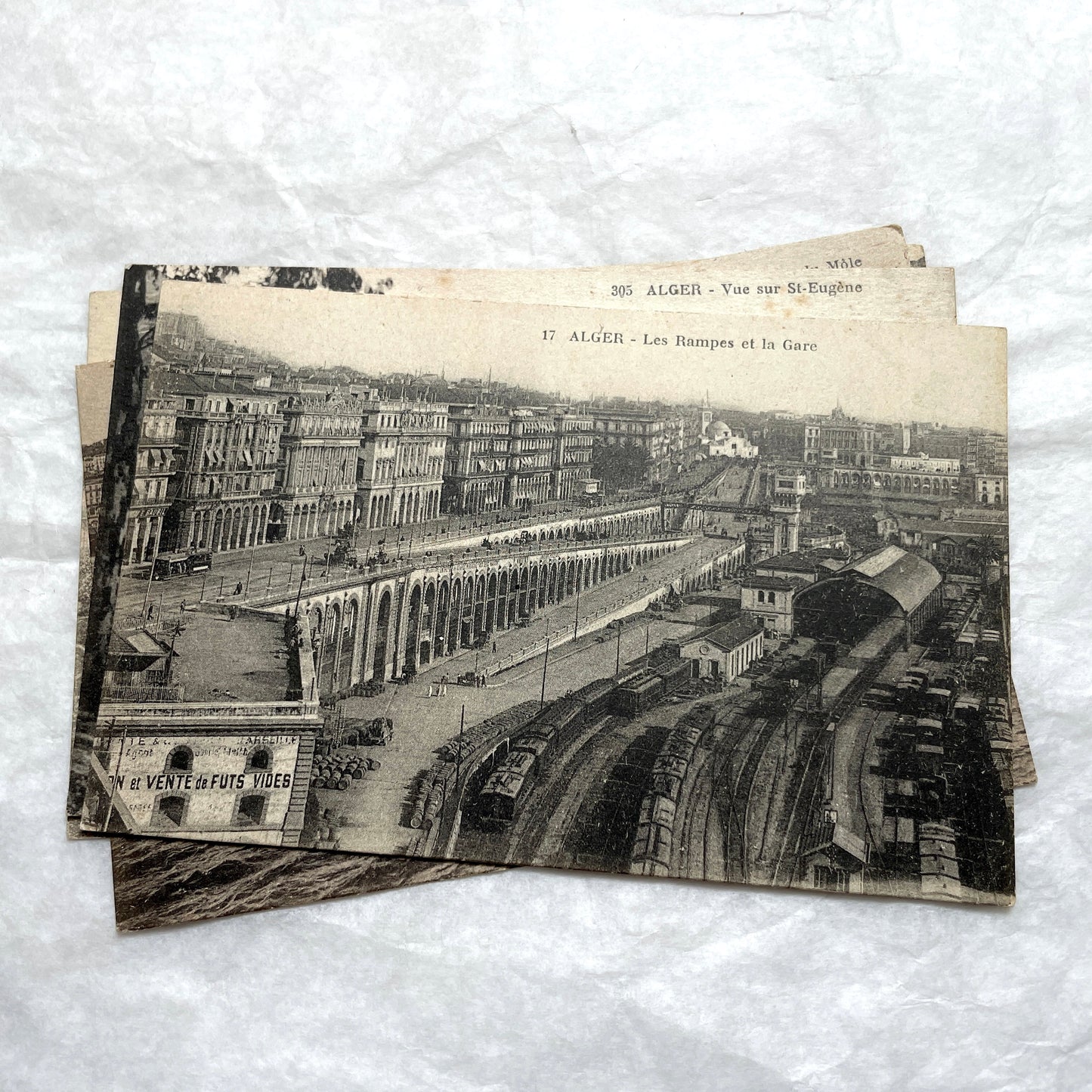 Lot of 1910s Algiers postcards showing French colonial city views, harbor, train station, and theater architecture.