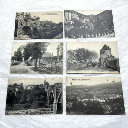 Lot of 1910s French postcards showing historic village scenes, old ramparts, a bridge, and a tower in France.