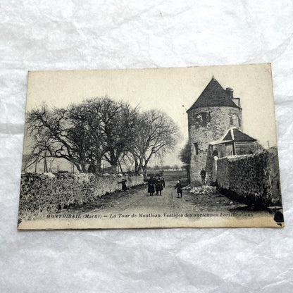 Lot of 1910s French postcards showing historic village scenes, old ramparts, a bridge, and a tower in France.