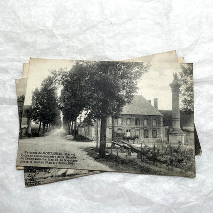 Lot of 1910s French postcards showing historic village scenes, old ramparts, a bridge, and a tower in France.