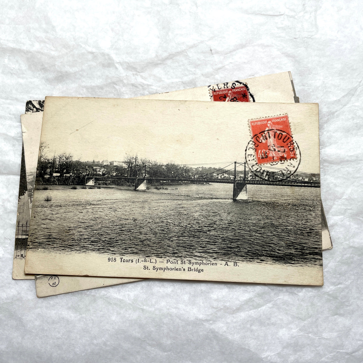 Lot of 8 1910s French postcards showing various historic town views, architecture, and landscapes with stamps.