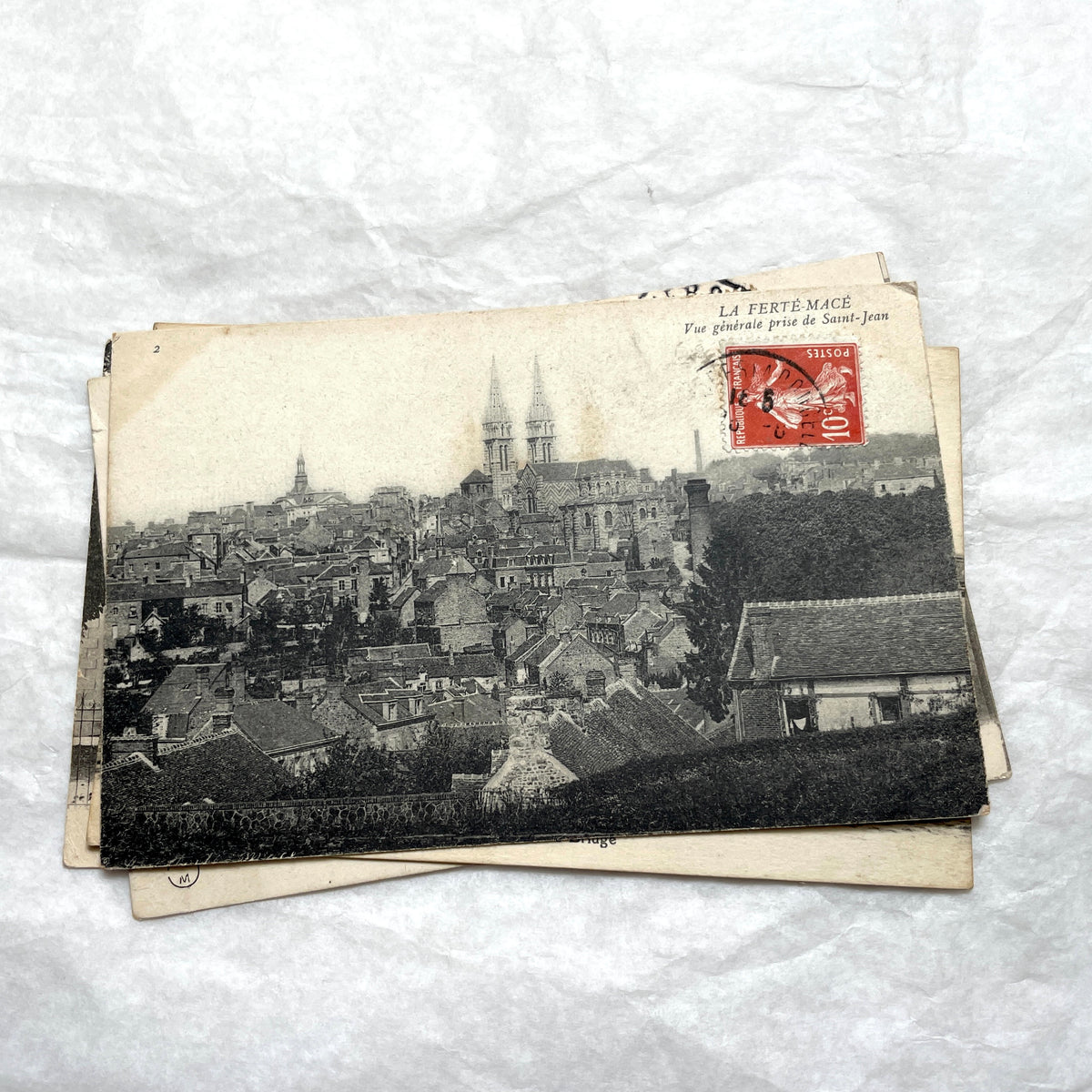 Lot of 8 1910s French postcards showing various historic town views, architecture, and landscapes with stamps.