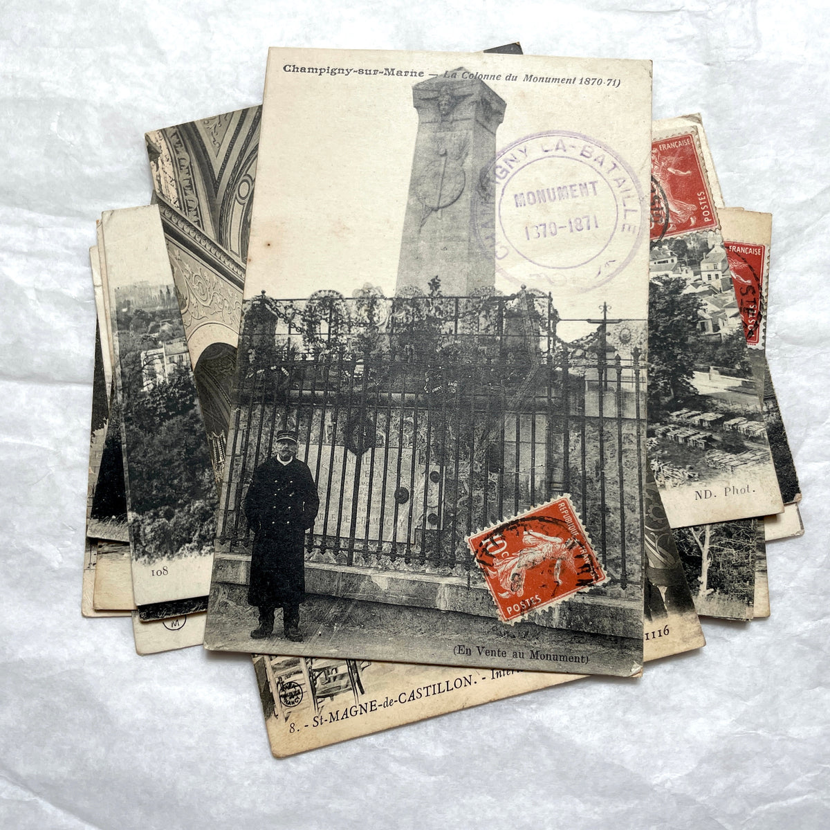 Lot of 8 1910s French postcards showing various historic town views, architecture, and landscapes with stamps.