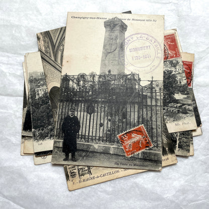 Lot of 8 1910s French postcards showing various historic town views, architecture, and landscapes with stamps.