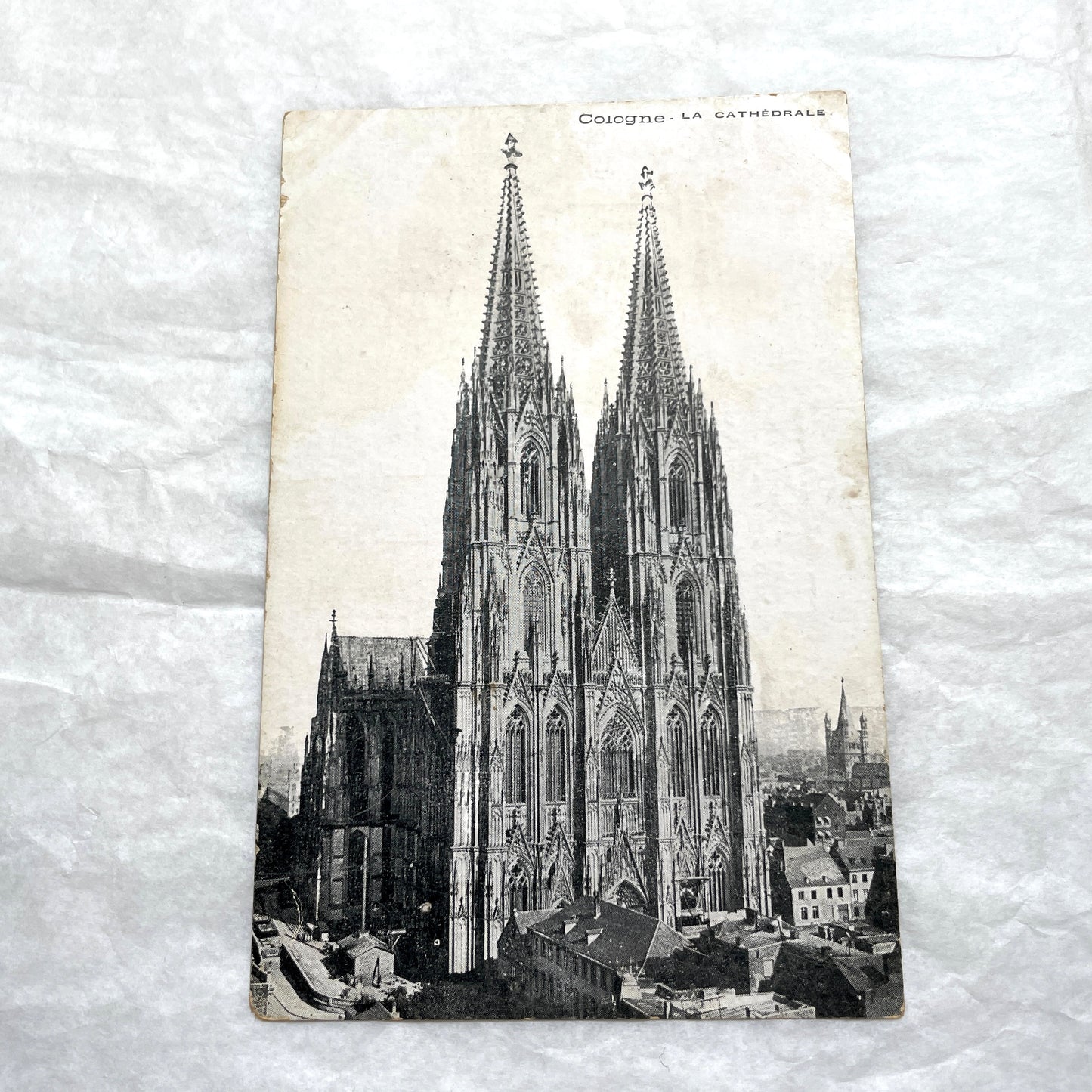 Four 1900s vintage postcards featuring detailed black and white views of European Gothic cathedrals and iconic towers.