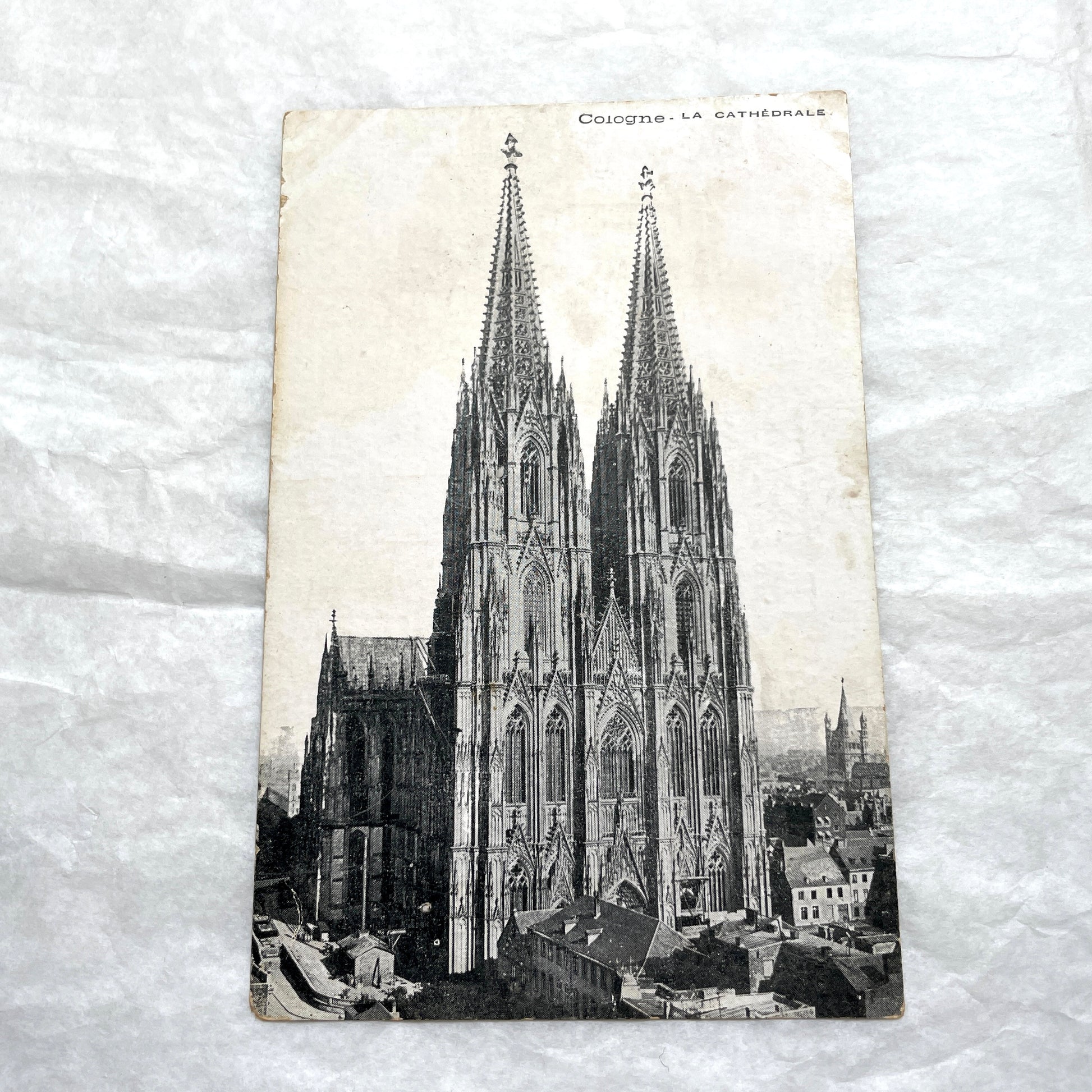 Four 1900s vintage postcards featuring detailed black and white views of European Gothic cathedrals and iconic towers.