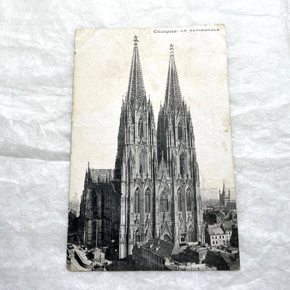 Four 1900s vintage postcards featuring detailed black and white views of European Gothic cathedrals and iconic towers.