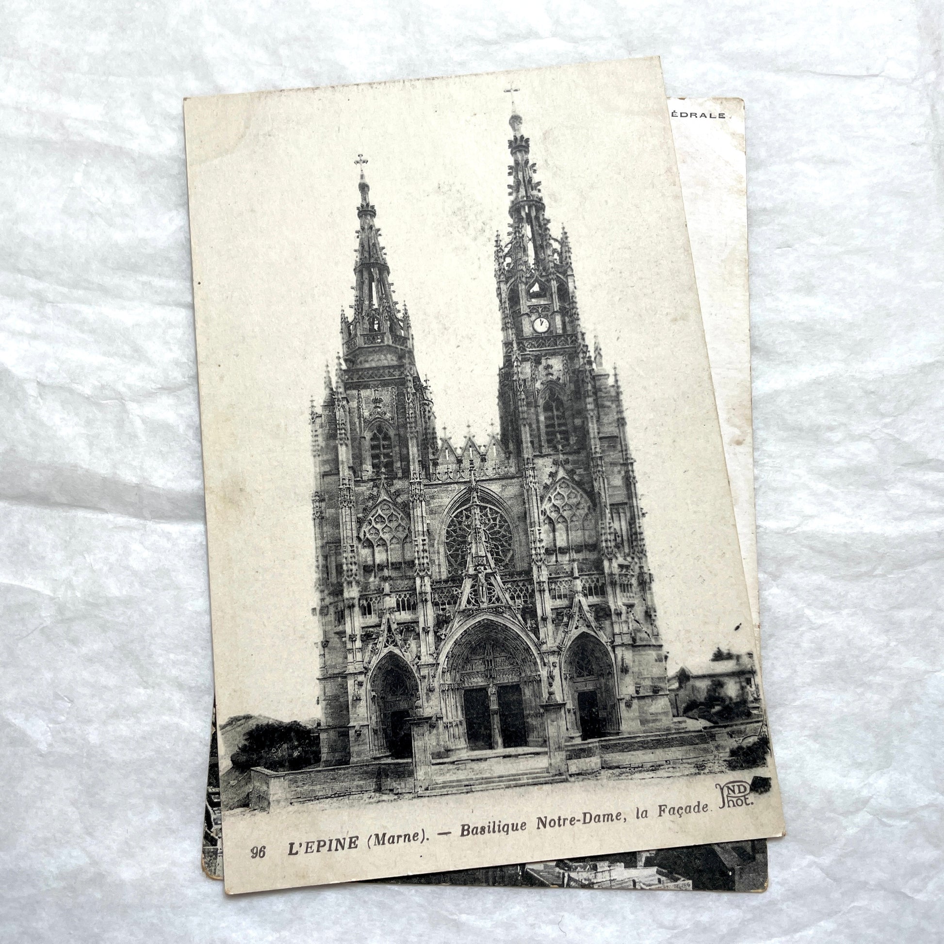 Four 1900s vintage postcards featuring detailed black and white views of European Gothic cathedrals and iconic towers.