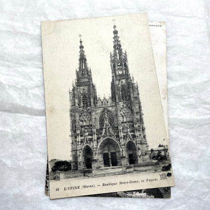 Four 1900s vintage postcards featuring detailed black and white views of European Gothic cathedrals and iconic towers.