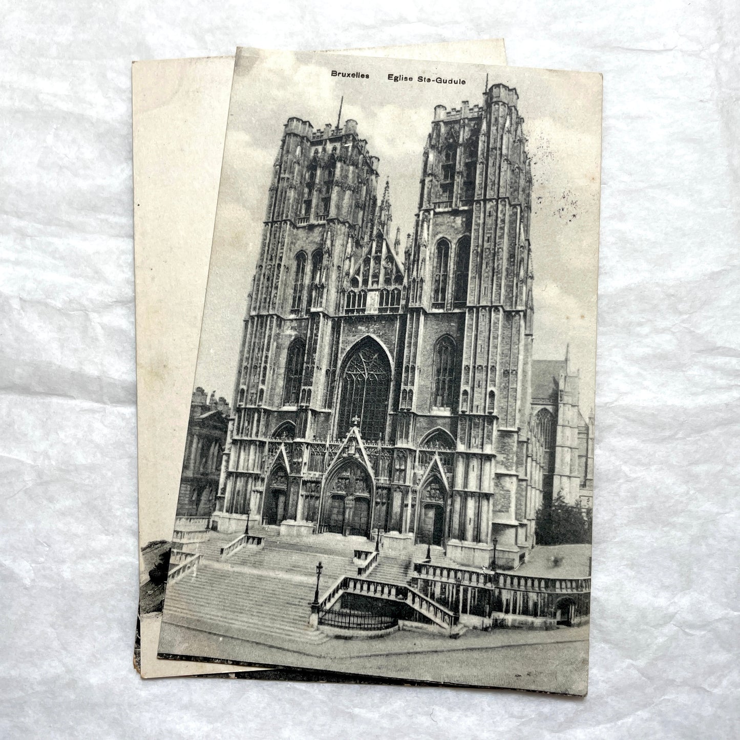 Four 1900s vintage postcards featuring detailed black and white views of European Gothic cathedrals and iconic towers.
