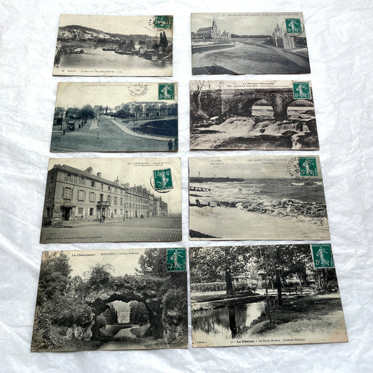 Lot of 8 1900s French postcards depicting various early 20th-century French towns, cities, and landscapes.