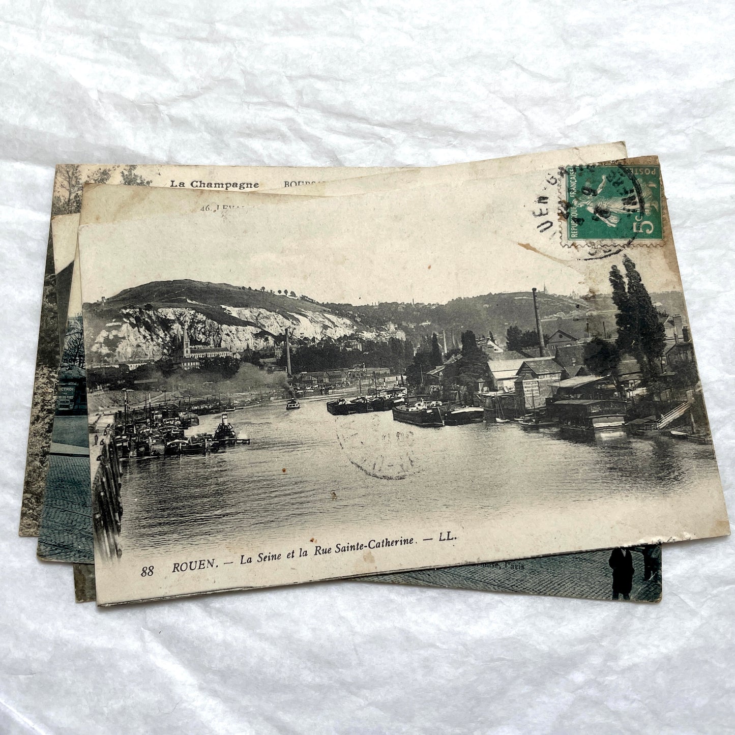Lot of 8 1900s French postcards depicting various early 20th-century French towns, cities, and landscapes.