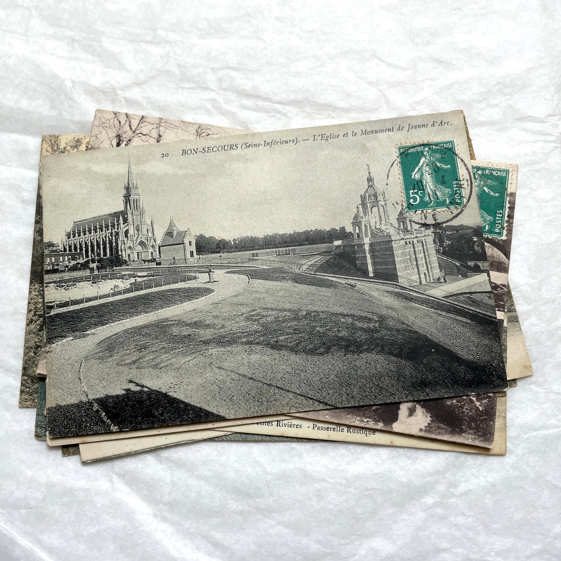 Lot of 8 1900s French postcards depicting various early 20th-century French towns, cities, and landscapes.