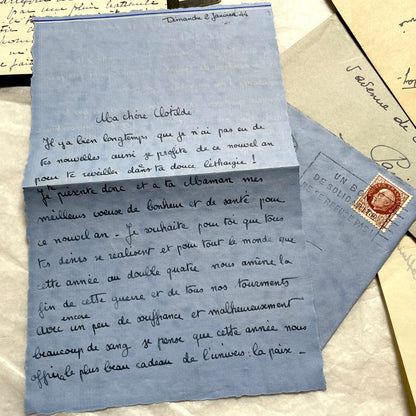 1940s French wartime letters lot with handwritten script, original stamps, and a 'Prisonnier de Guerre' document.