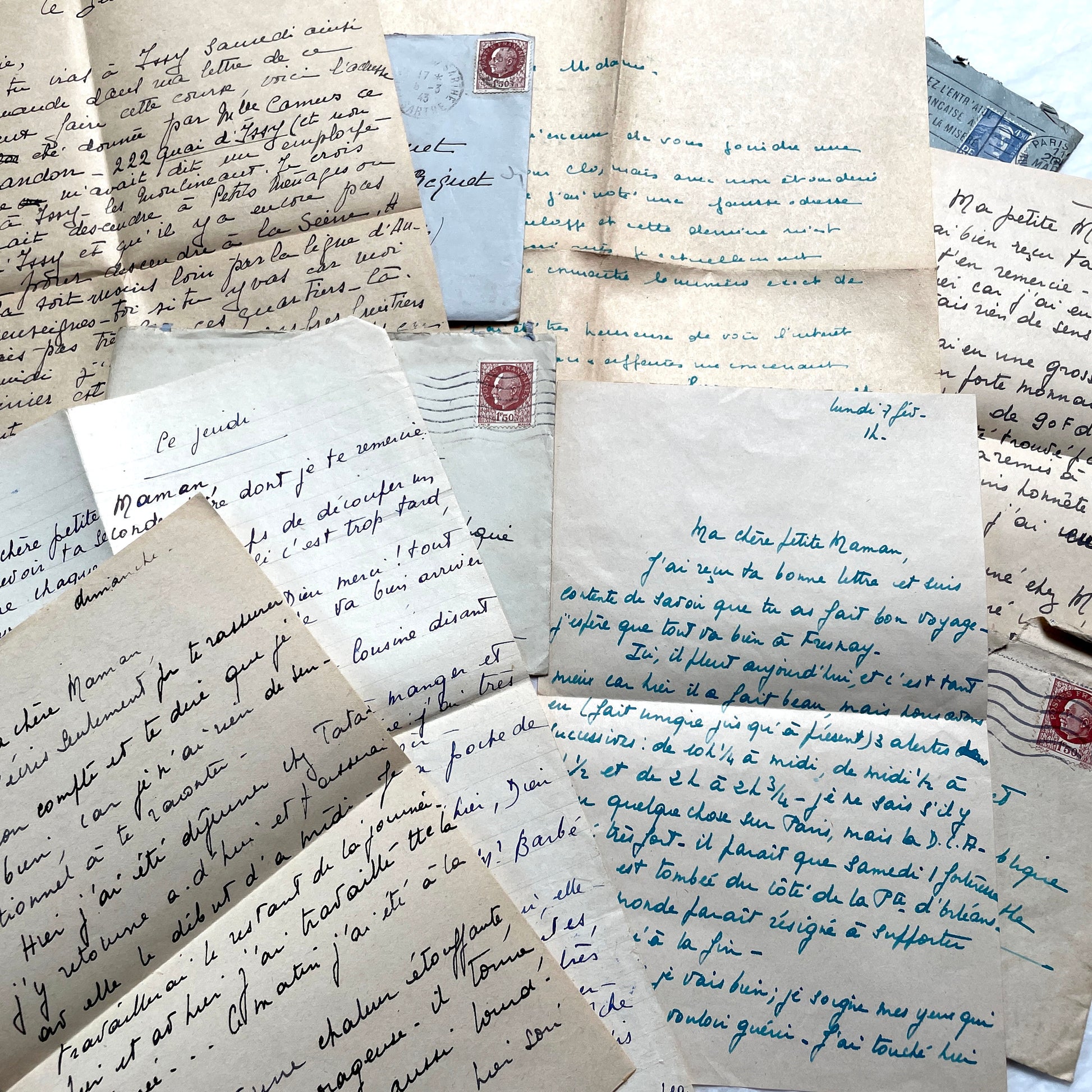 1940s French handwritten letters lot with envelopes and wartime stamps, showcasing vintage paper and cursive script.