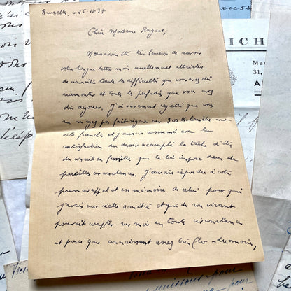 Set of 10 1930s vintage French letters with intricate handwritten script on antique paper, offering historical insight.