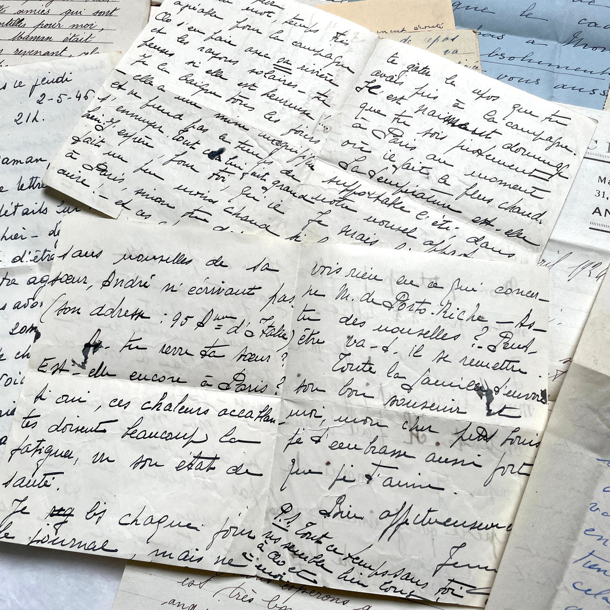 Set of 10 1930s vintage French letters with intricate handwritten script on antique paper, offering historical insight.