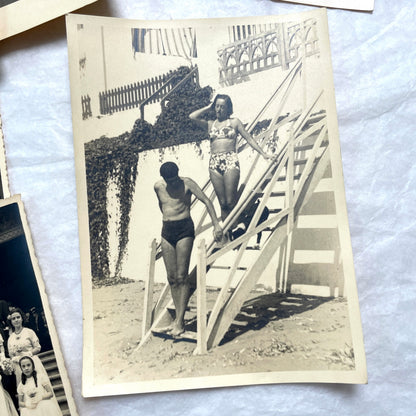 Lot of 1940s vintage photographs featuring family portraits, wedding scenes, beachgoers, and a person riding a camel.