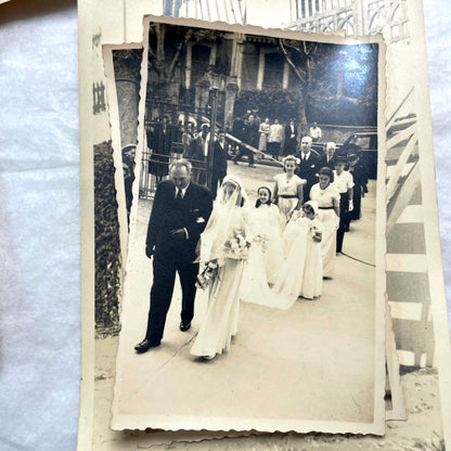 Lot of 1940s vintage photographs featuring family portraits, wedding scenes, beachgoers, and a person riding a camel.