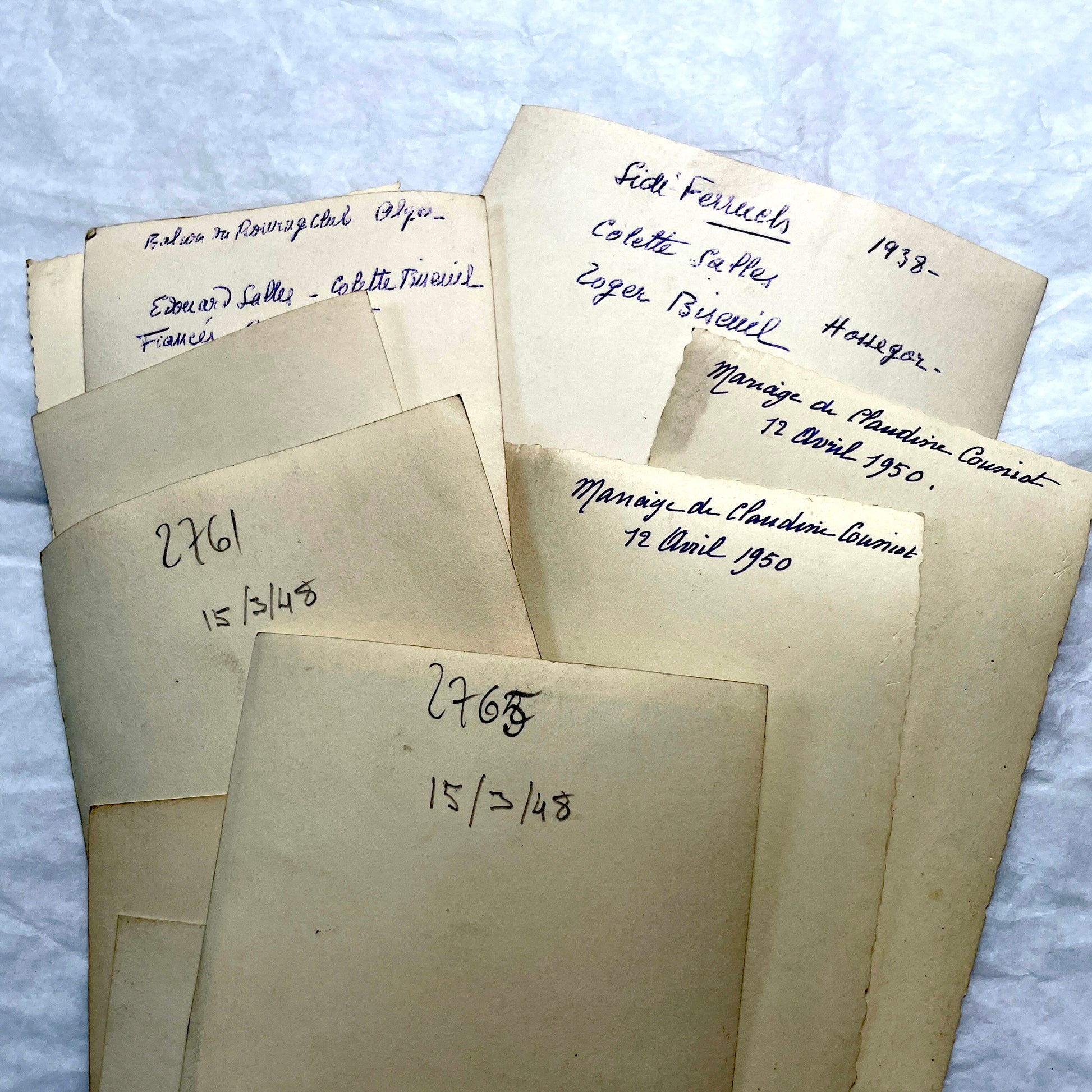 Lot of 1940s vintage photographs featuring family portraits, wedding scenes, beachgoers, and a person riding a camel.
