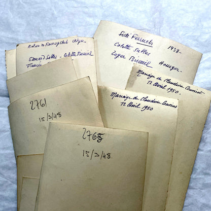 Lot of 1940s vintage photographs featuring family portraits, wedding scenes, beachgoers, and a person riding a camel.