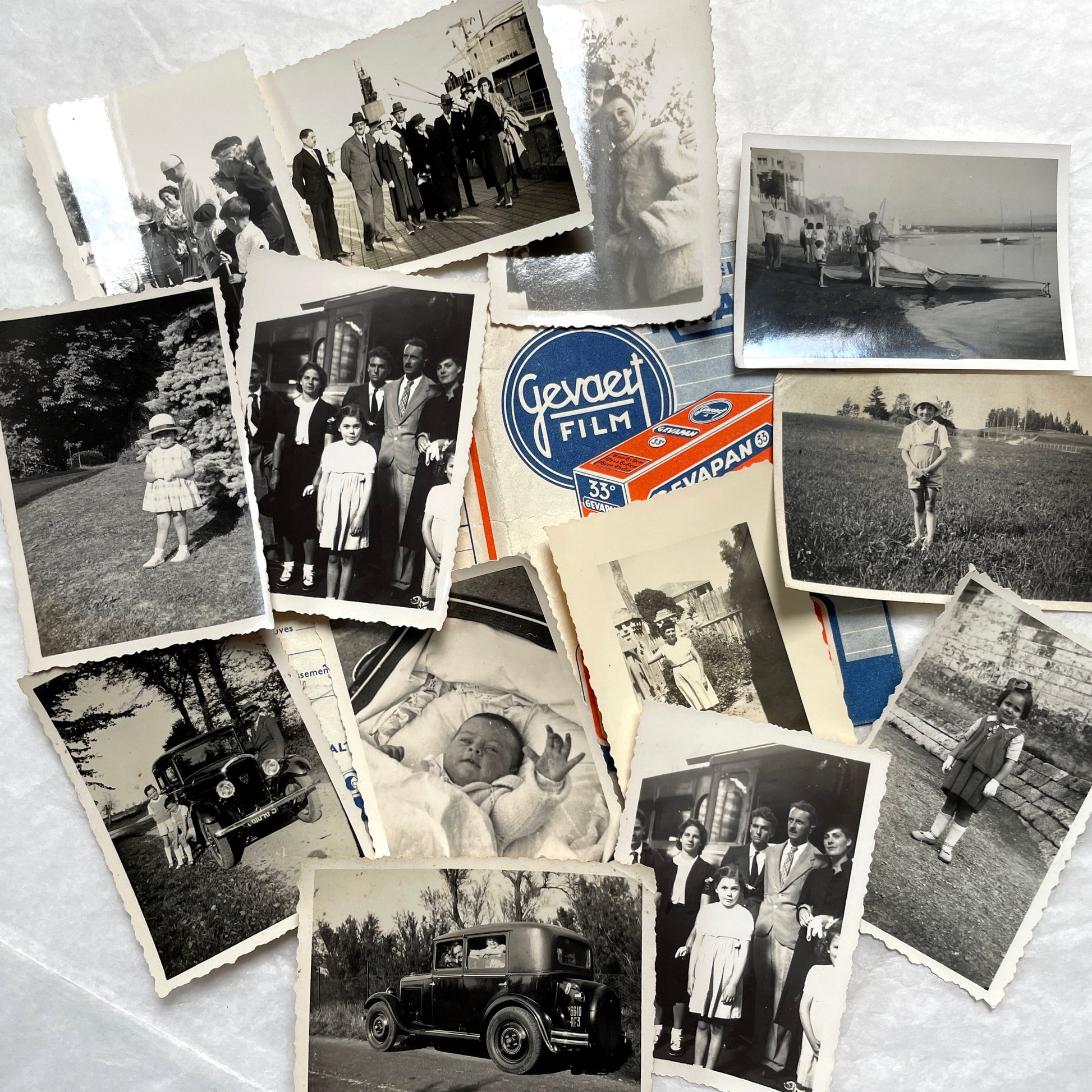 1930s vintage photographs lot showing European family life, children, classic cars, and travel scenes including a ship.
