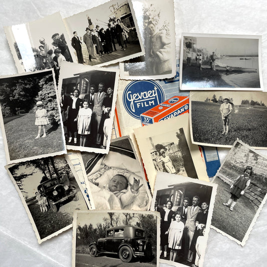 1930s vintage photographs lot showing European family life, children, classic cars, and travel scenes including a ship.