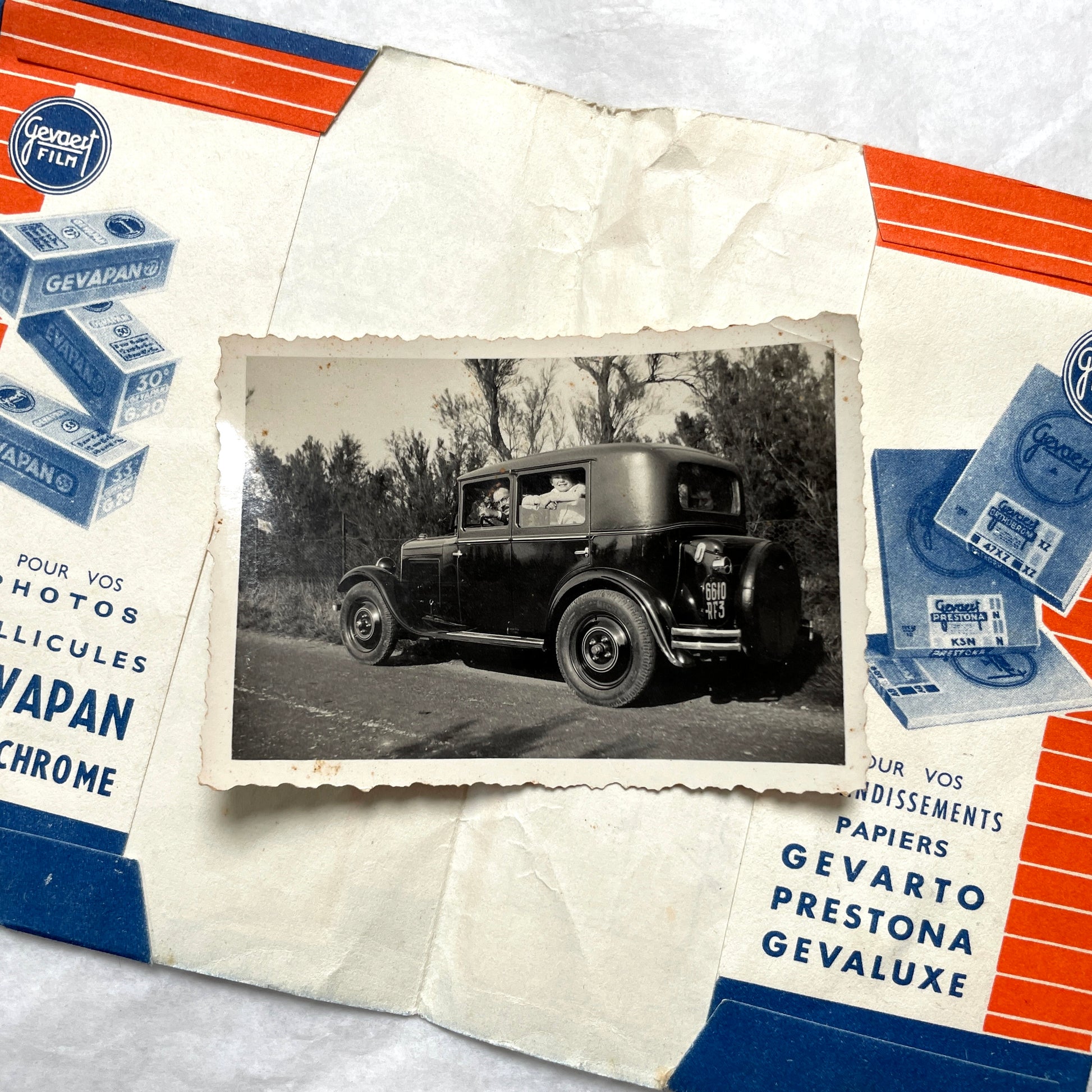 1930s vintage photographs lot showing European family life, children, classic cars, and travel scenes including a ship.