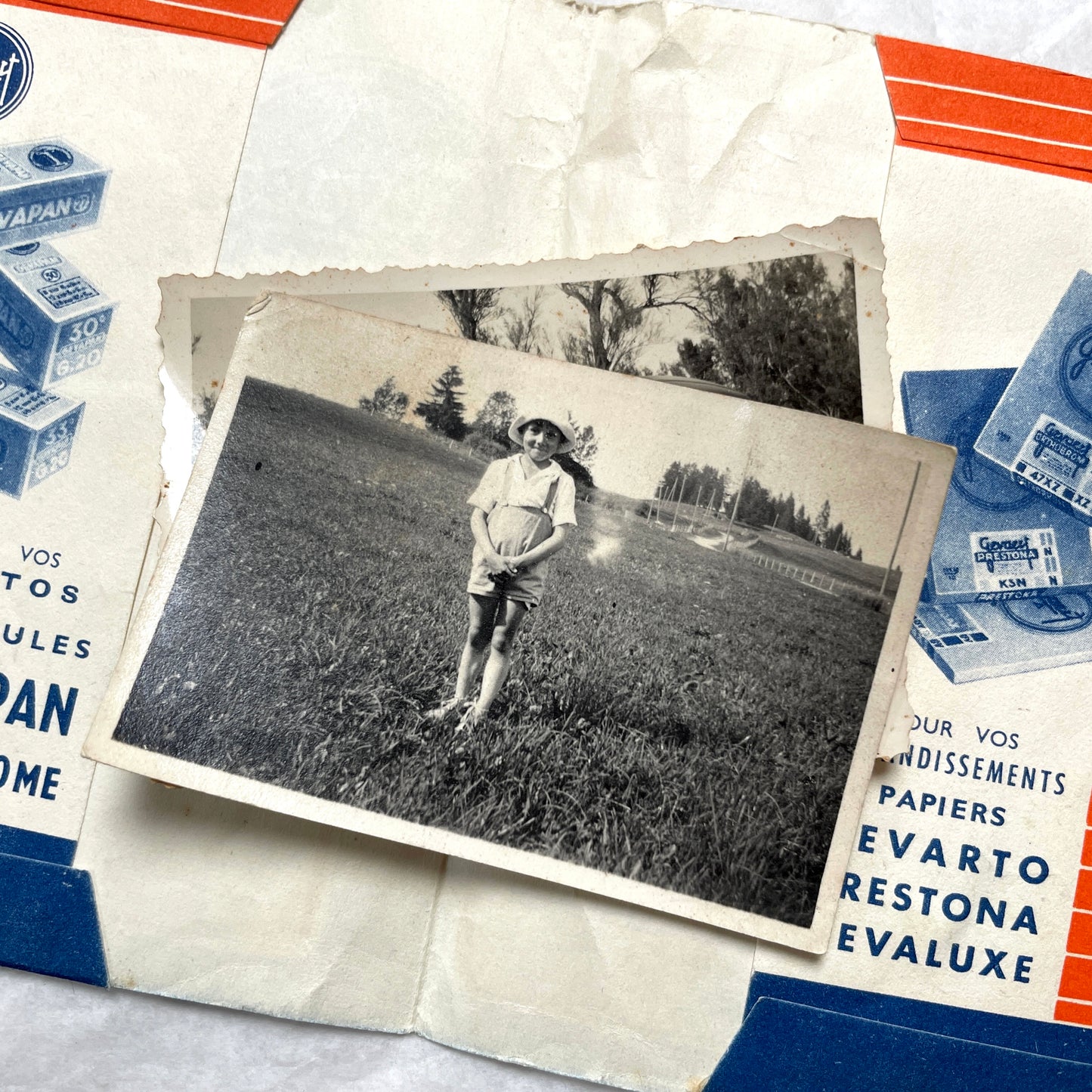 1930s vintage photographs lot showing European family life, children, classic cars, and travel scenes including a ship.