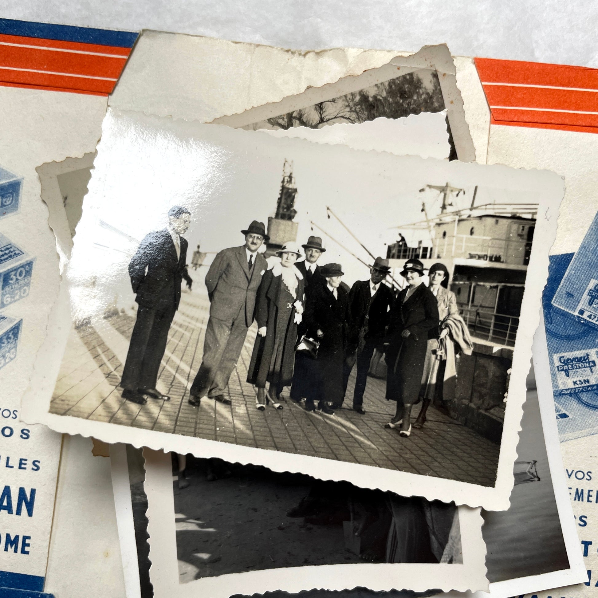 1930s vintage photographs lot showing European family life, children, classic cars, and travel scenes including a ship.