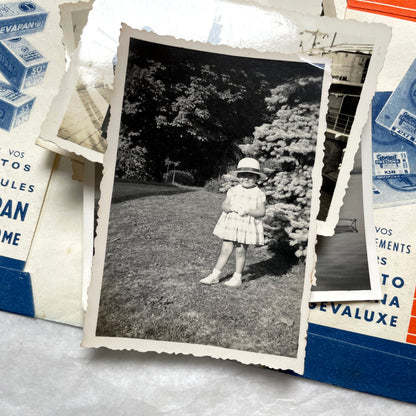 1930s vintage photographs lot showing European family life, children, classic cars, and travel scenes including a ship.