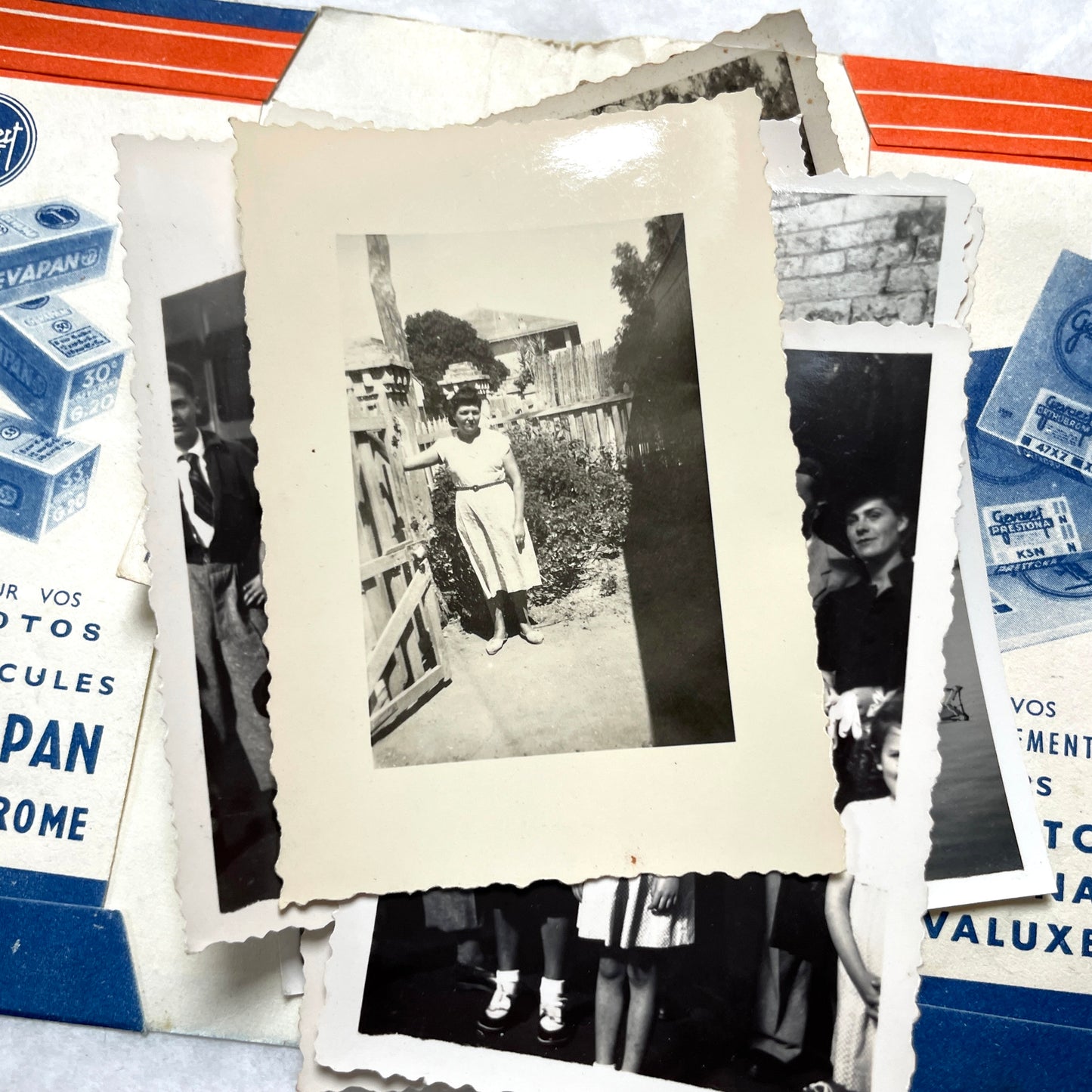 1930s vintage photographs lot showing European family life, children, classic cars, and travel scenes including a ship.