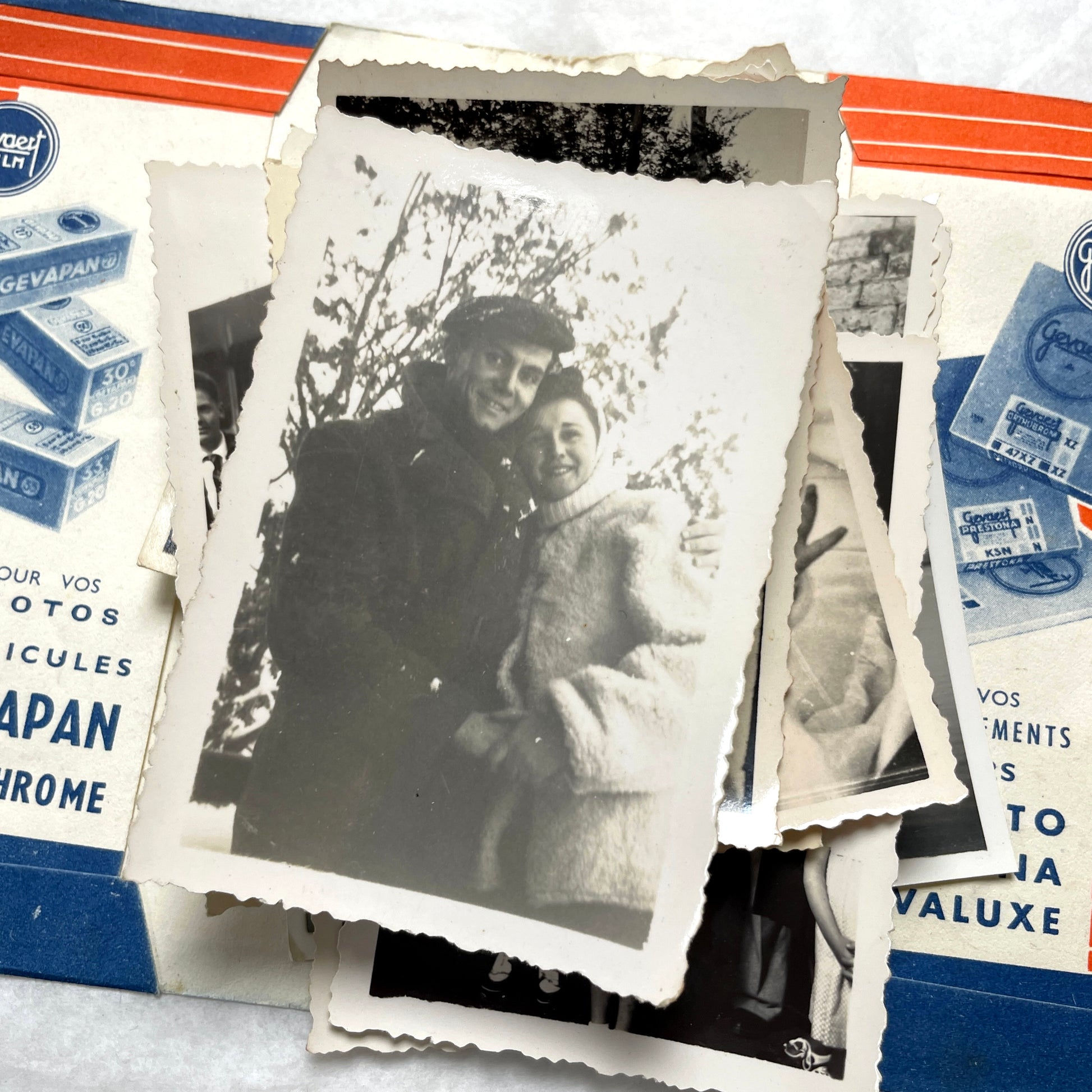 1930s vintage photographs lot showing European family life, children, classic cars, and travel scenes including a ship.