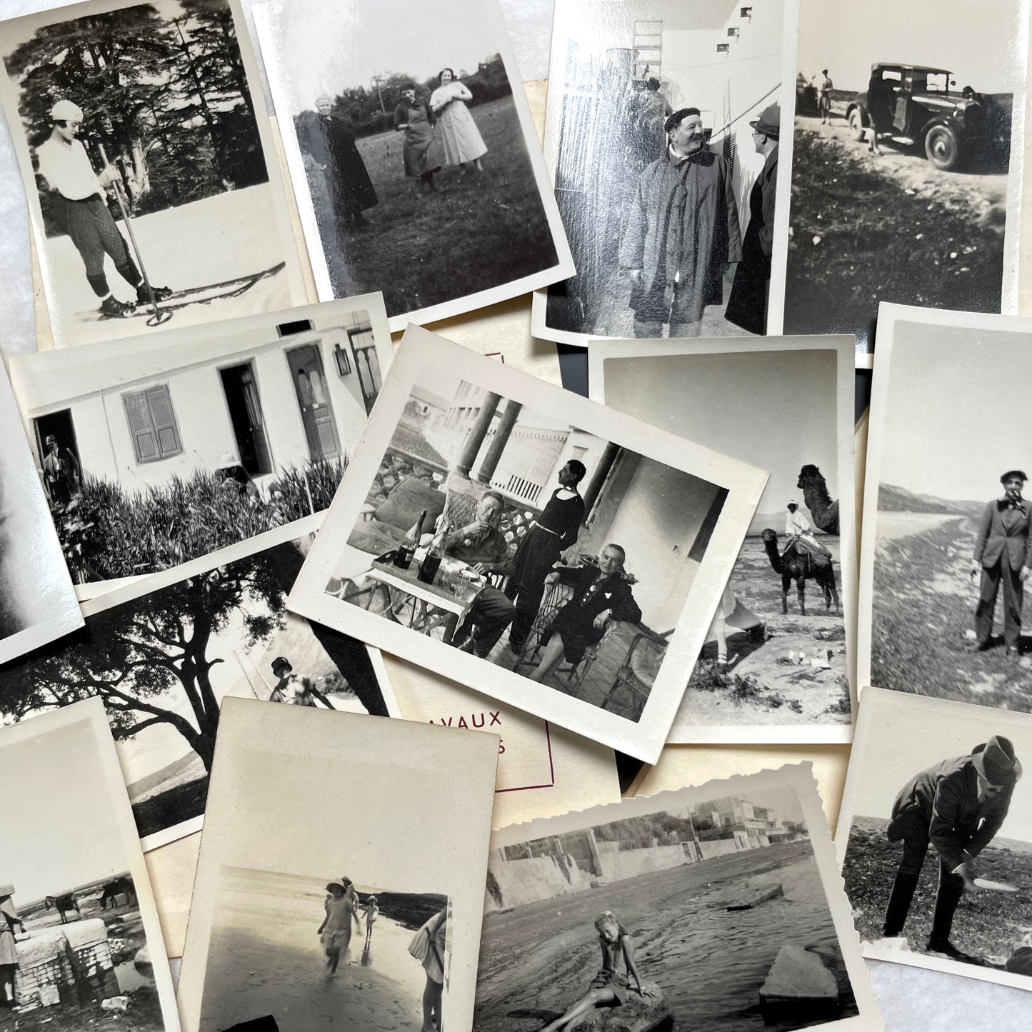 1930s vintage photograph lot showing French family life, travel, skiing, beach scenes, and a vintage car.