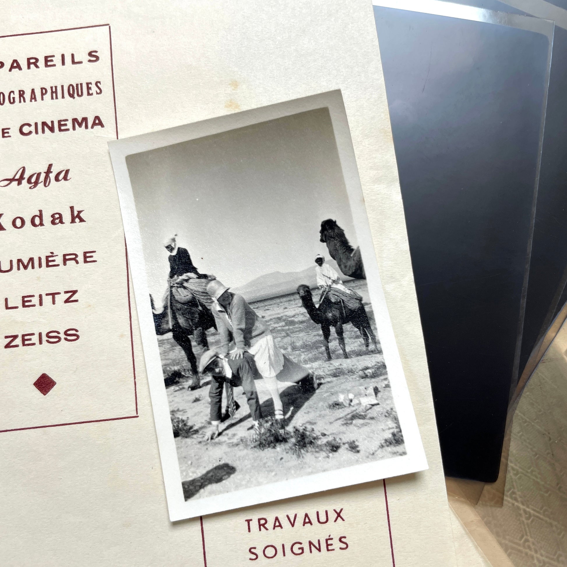 1930s vintage photograph lot showing French family life, travel, skiing, beach scenes, and a vintage car.