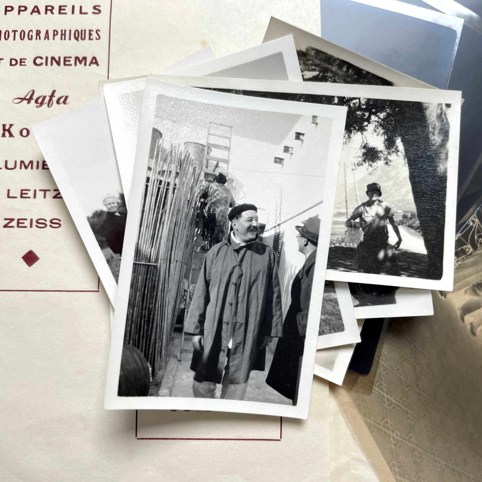 1930s vintage photograph lot showing French family life, travel, skiing, beach scenes, and a vintage car.