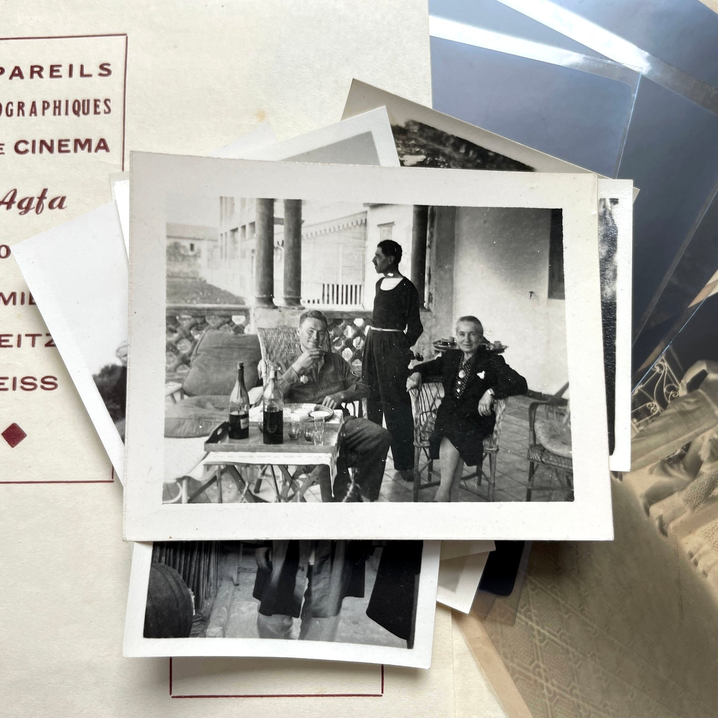 1930s vintage photograph lot showing French family life, travel, skiing, beach scenes, and a vintage car.