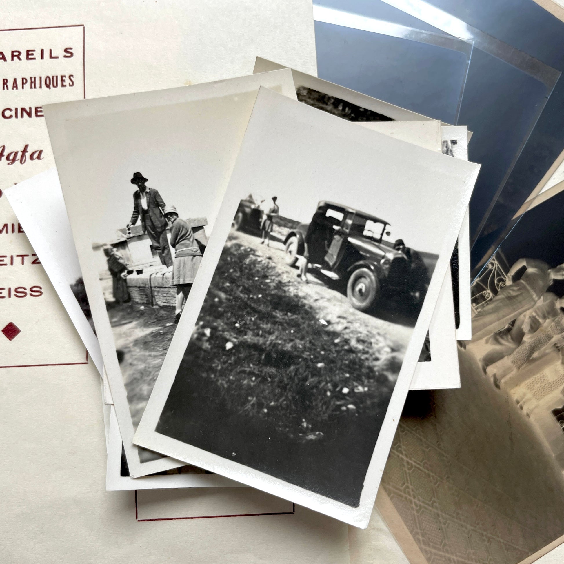 1930s vintage photograph lot showing French family life, travel, skiing, beach scenes, and a vintage car.