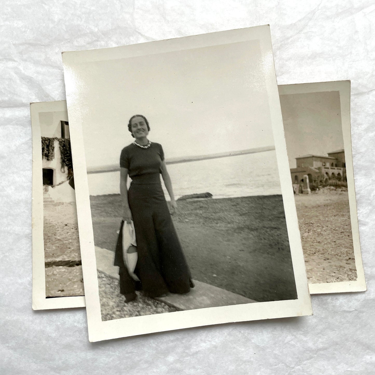 1950s French photograph lot - various black and white images of families, beach scenes, and street life in Algeria.