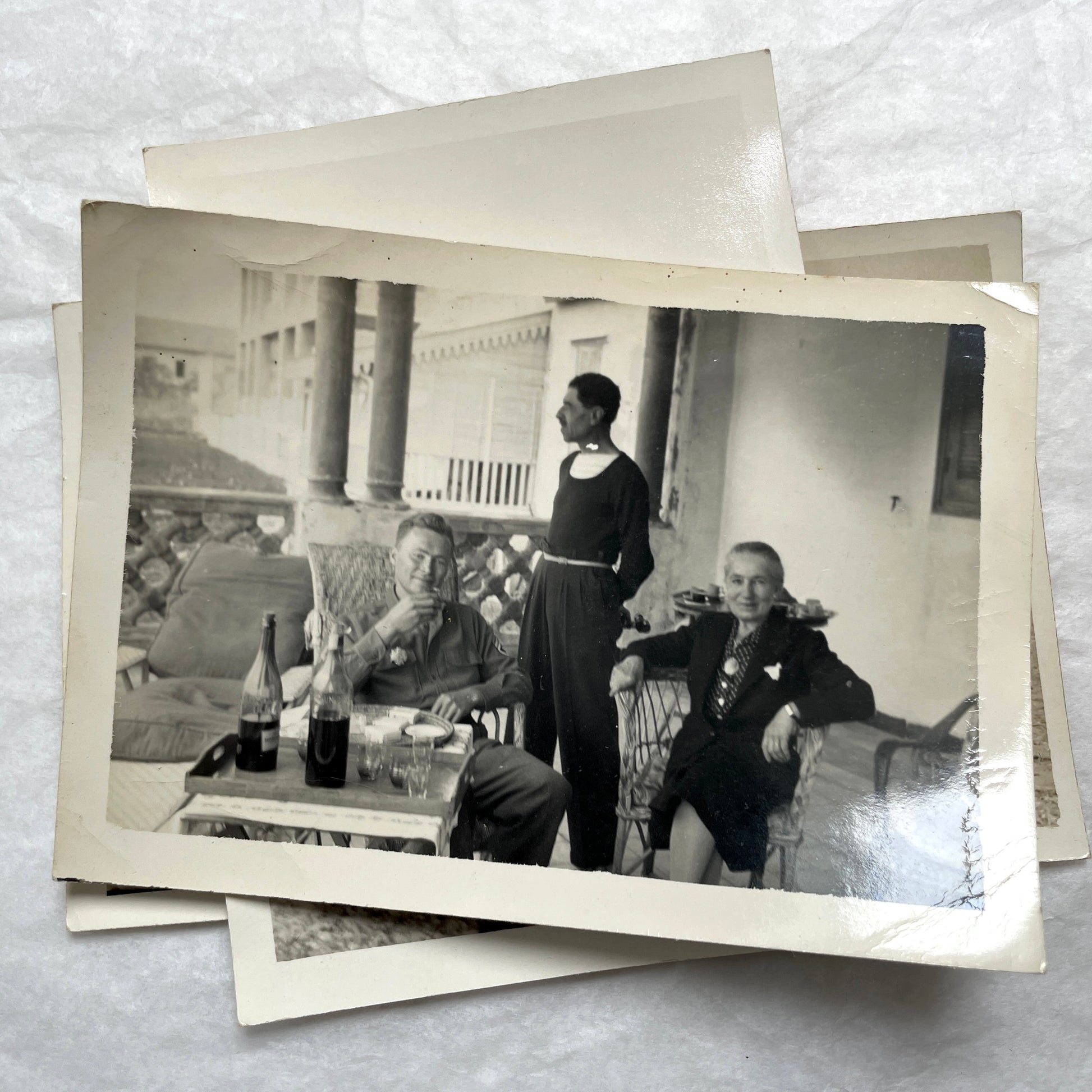 1950s French photograph lot - various black and white images of families, beach scenes, and street life in Algeria.