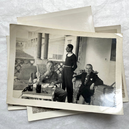 1950s French photograph lot - various black and white images of families, beach scenes, and street life in Algeria.