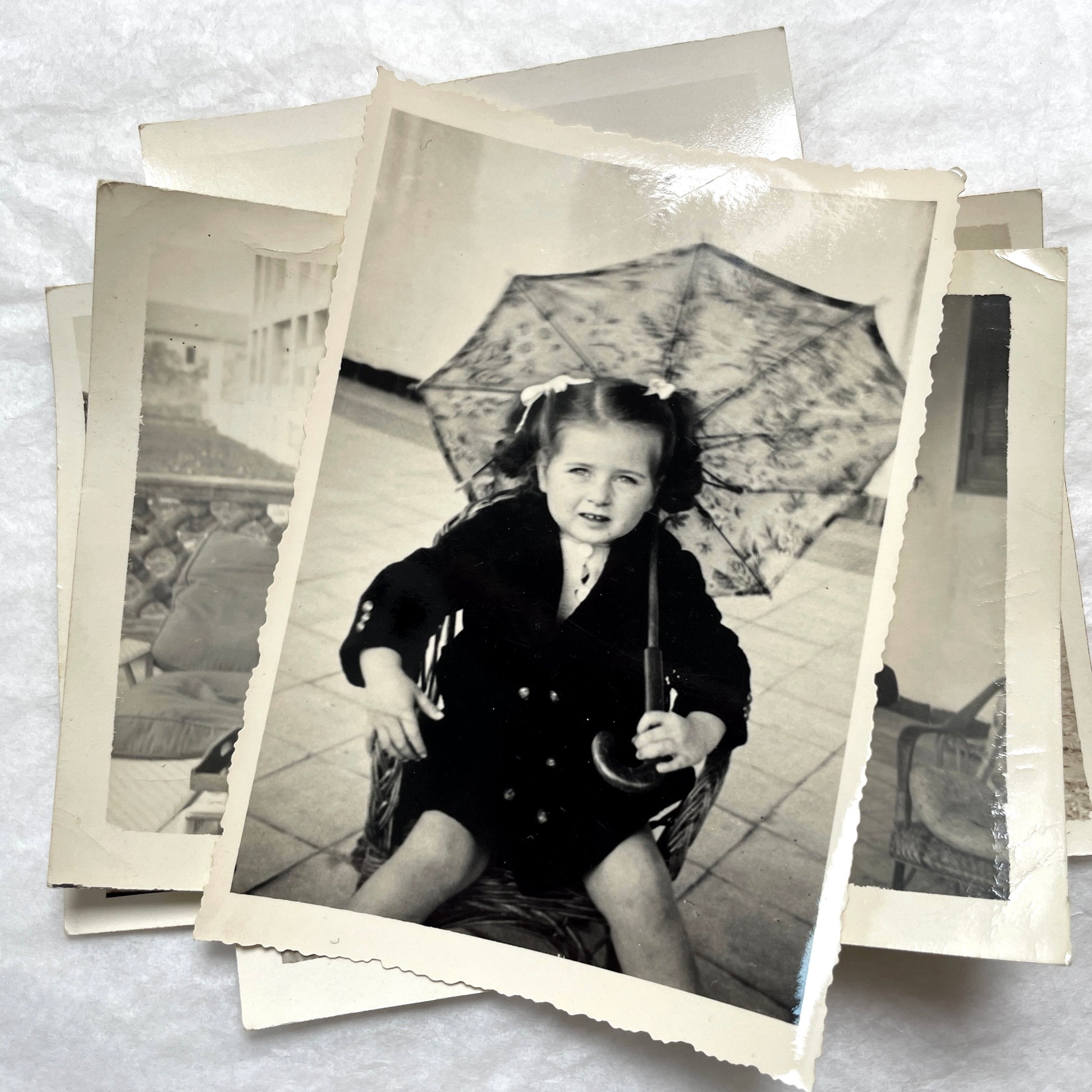 1950s French photograph lot - various black and white images of families, beach scenes, and street life in Algeria.