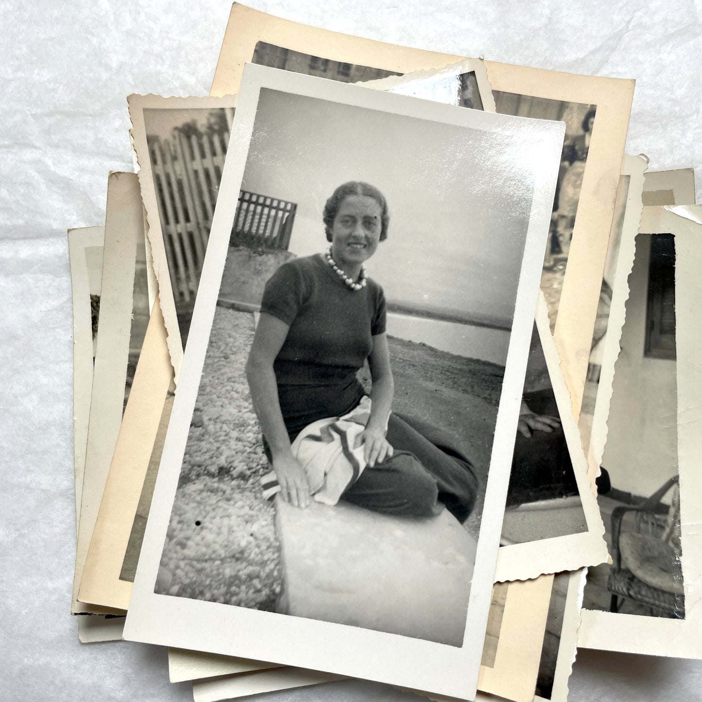 1950s French photograph lot - various black and white images of families, beach scenes, and street life in Algeria.