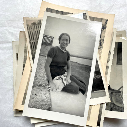 1950s French photograph lot - various black and white images of families, beach scenes, and street life in Algeria.