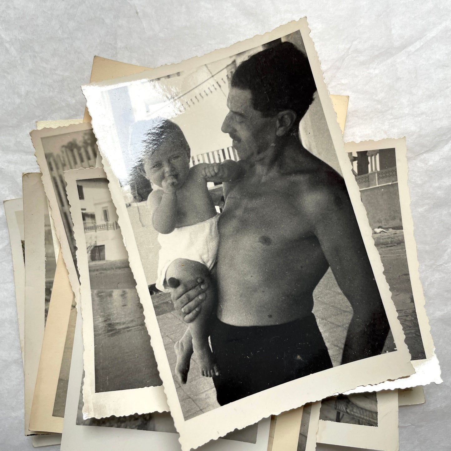 1950s French photograph lot - various black and white images of families, beach scenes, and street life in Algeria.