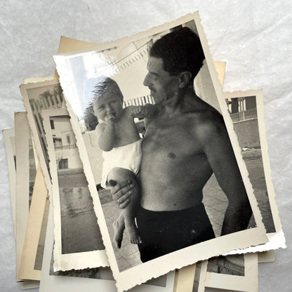 1950s French photograph lot - various black and white images of families, beach scenes, and street life in Algeria.