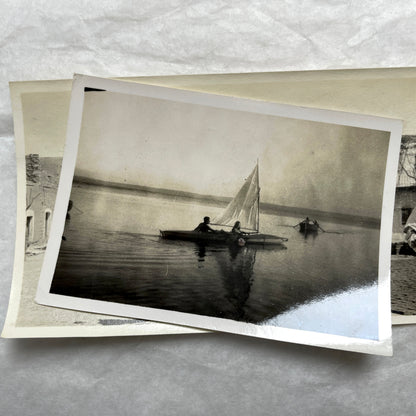 Lot of 1940s vintage photographs showing people skiing, a camel rider, an ocean scene with a military man, and a dog.