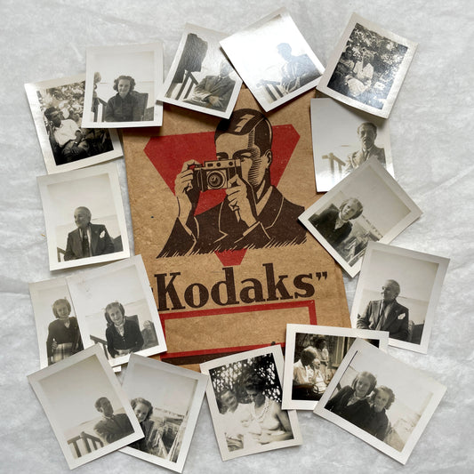 1940s vintage photographs lot featuring assorted black and white family portraits and scenes on a classic Kodaks bag.