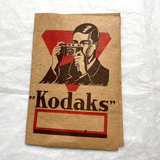 1940s vintage photographs lot featuring assorted black and white family portraits and scenes on a classic Kodaks bag.