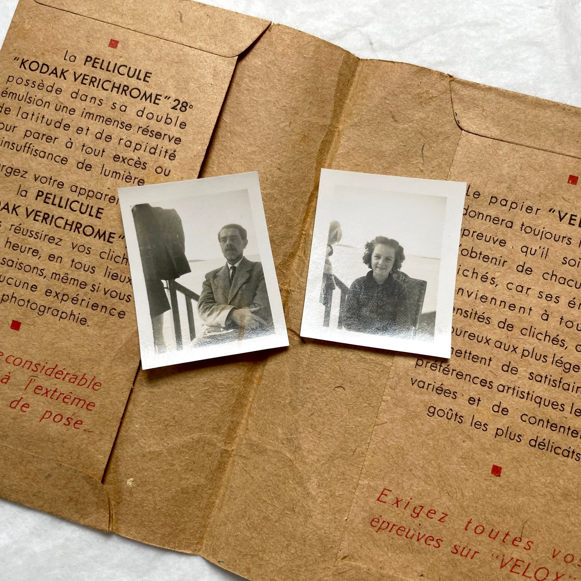 1940s vintage photographs lot featuring assorted black and white family portraits and scenes on a classic Kodaks bag.